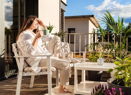 Woman enjoying her custom home backyard