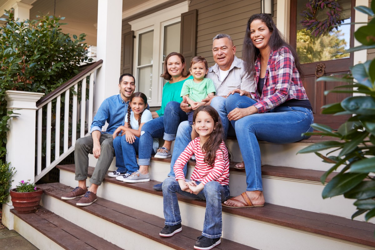 Family sitting on a custom home porch