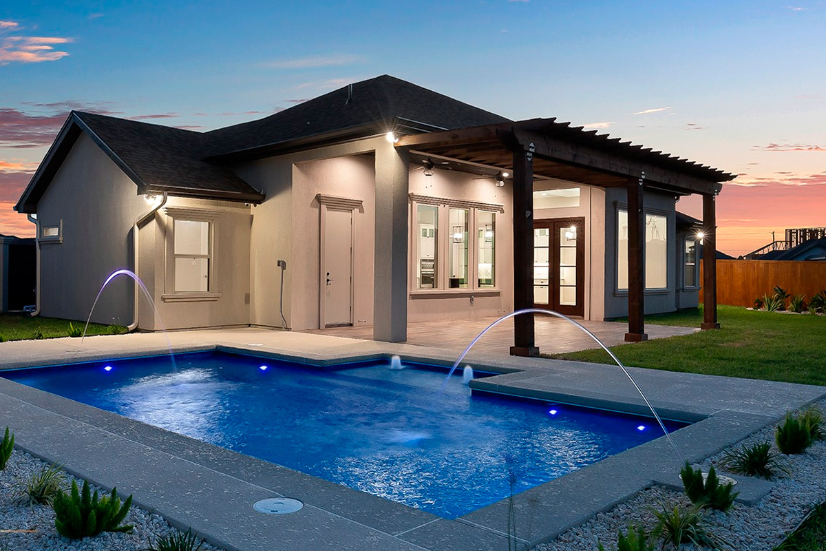 cover ima for Texas Backyard Living: Transform Your Outdoor for Summer. Bathtub in corian, Faucet and shower in tiled bathroom with windows towards garden