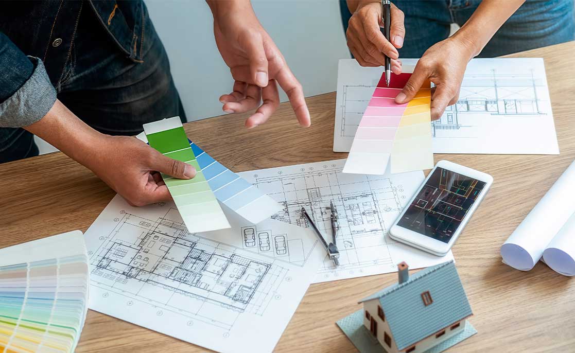 Two people engage in a home design project, focusing on custom building options in McAllen.